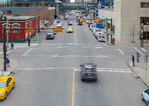 Scrambled intersection in downtown Calgary. Illustrates diagonal crossing lines in addition to traditional pedestrian crosswalks.