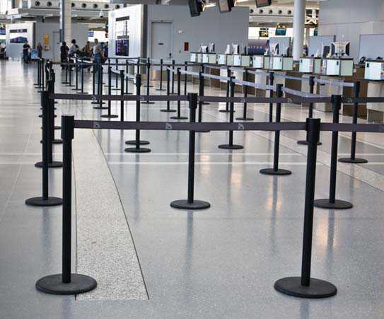 An example of a poor queuing system that projects into the space’s main path of travel. However, the system illustrates good colour contrast to the surrounding floor surface.